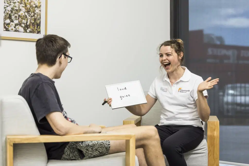 A speech pathologist and a client in a session at LifeWorks Cairns