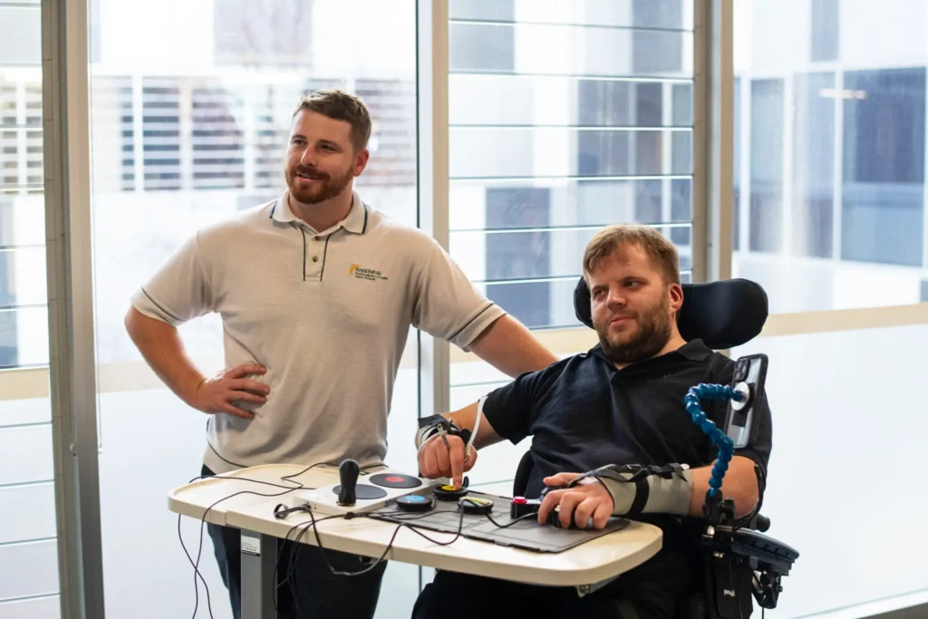 Clinician and Client playing adaptive gaming on console