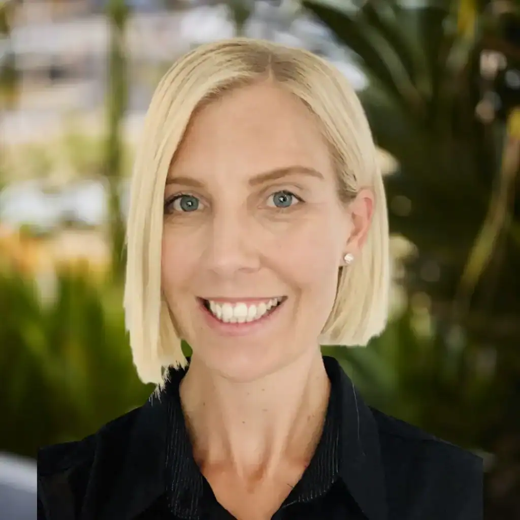 Smiling woman with blonde hair, representing recovery and well-being at Royal Rehab LifeWorks.