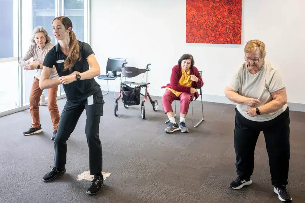 Group of seniors participating in neuro dance therapy at Royal Rehab LifeWorks center.