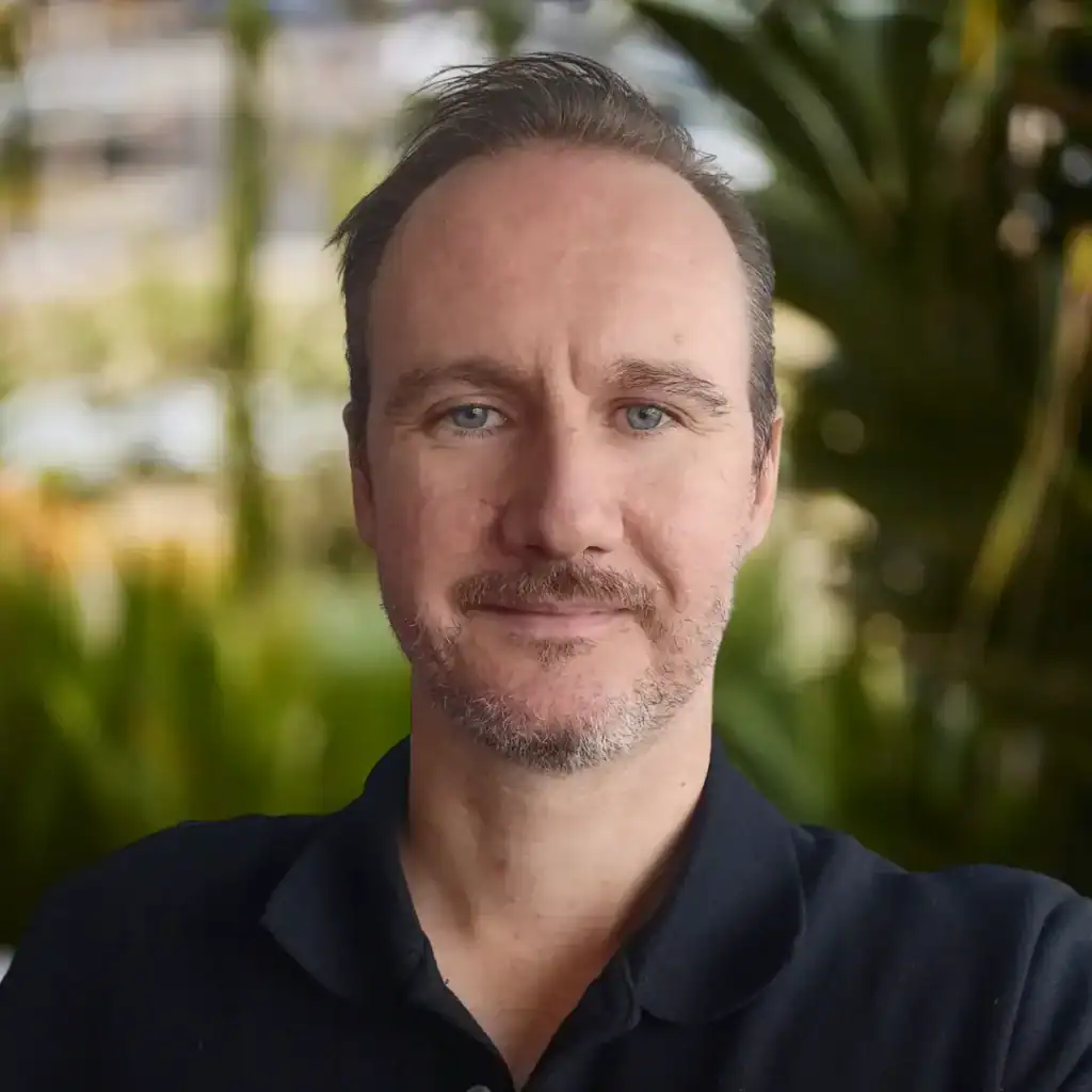 Person smiling outdoors, promoting recovery and well-being at Royal Rehab LifeWorks.